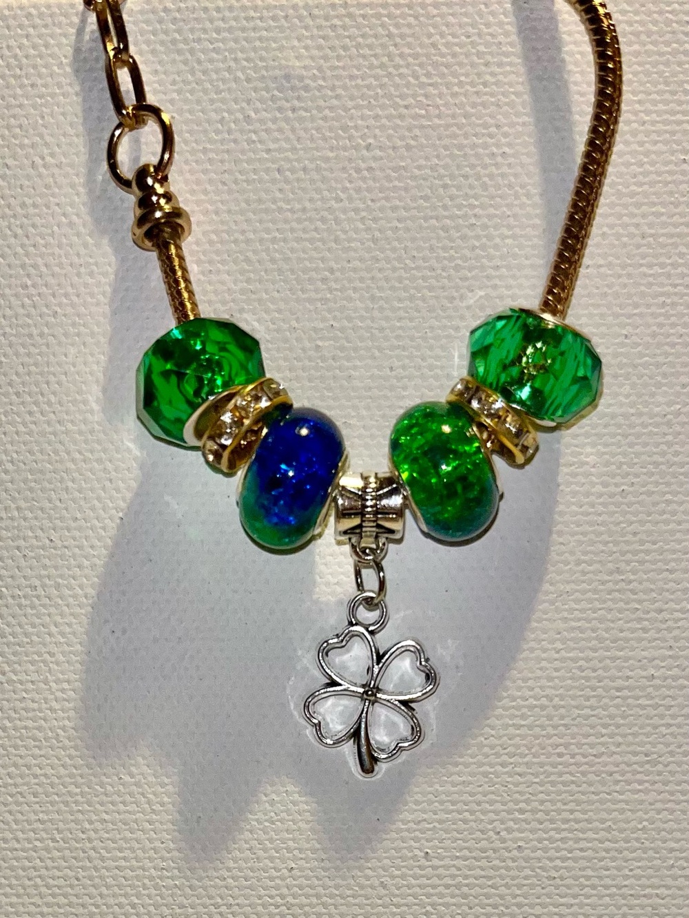 Gold-Tone Snake Chain Bracelet w/Green/Blue/Rhinestone Accents & Clover Charm